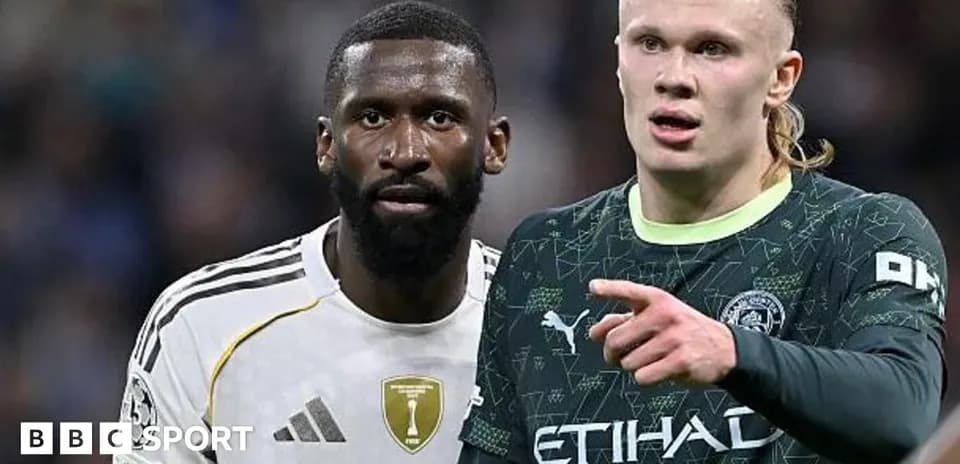 Two football players discussing during match action