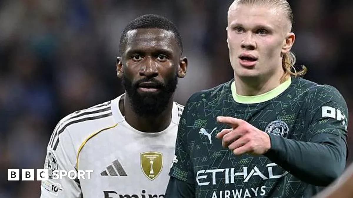 Two football players discussing during match action