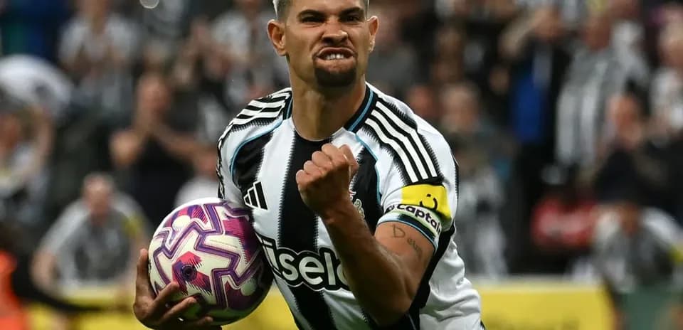Player celebrating with ball after scoring goal