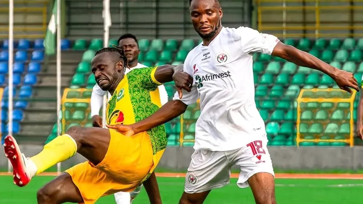Katsina United player tackles Rivers United player