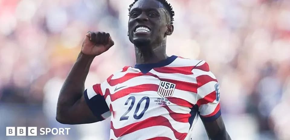 Player celebrating a goal in USA jersey
