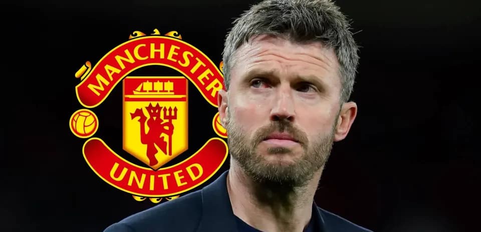 Manchester United logo behind a man in a suit