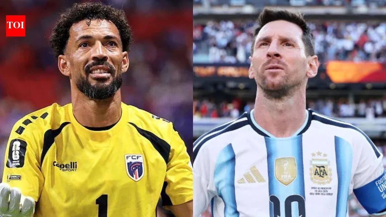 Goalkeeper and player from opposing teams during match