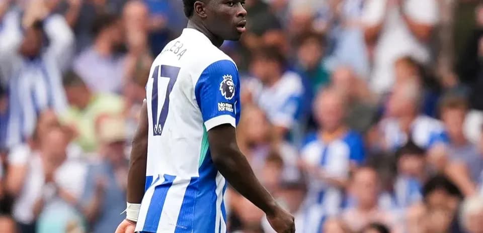 Player in blue and white kit during match