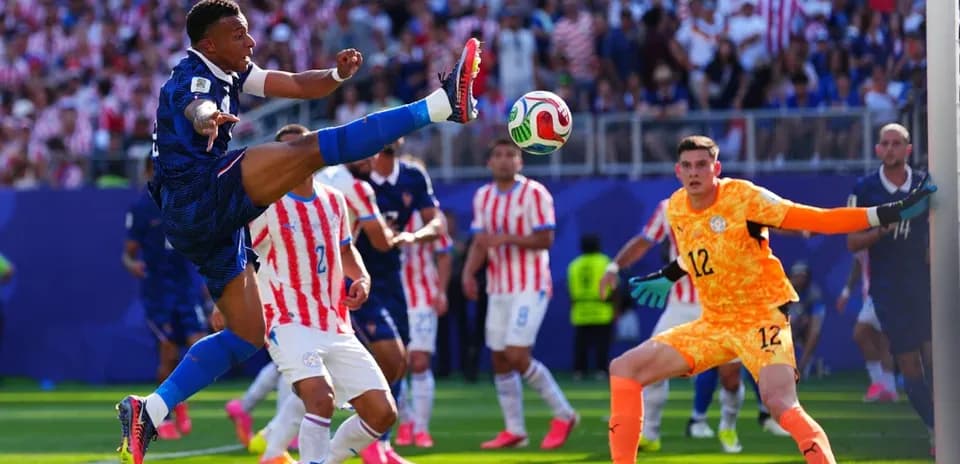 Player kicking ball during intense football match