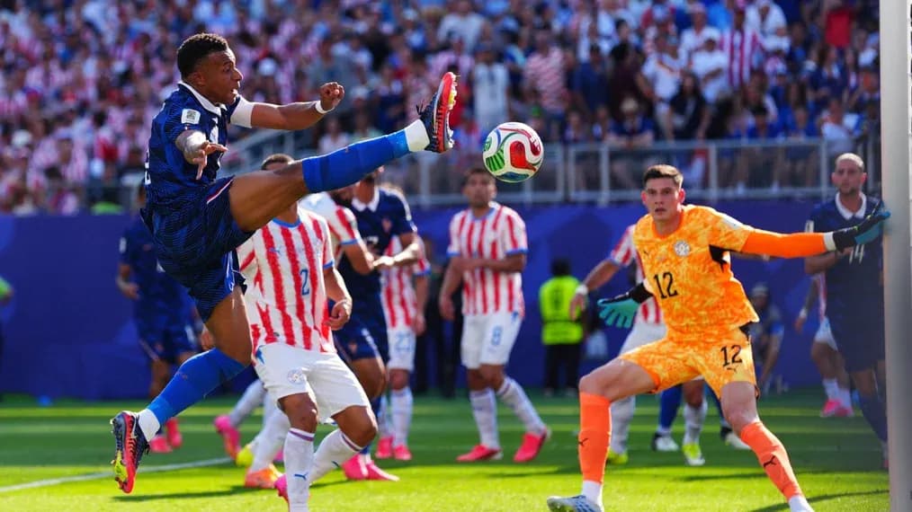 Player kicking ball during intense football match