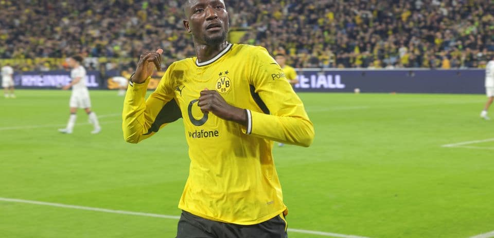 Player celebrating after scoring a goal for Borussia Dortmund