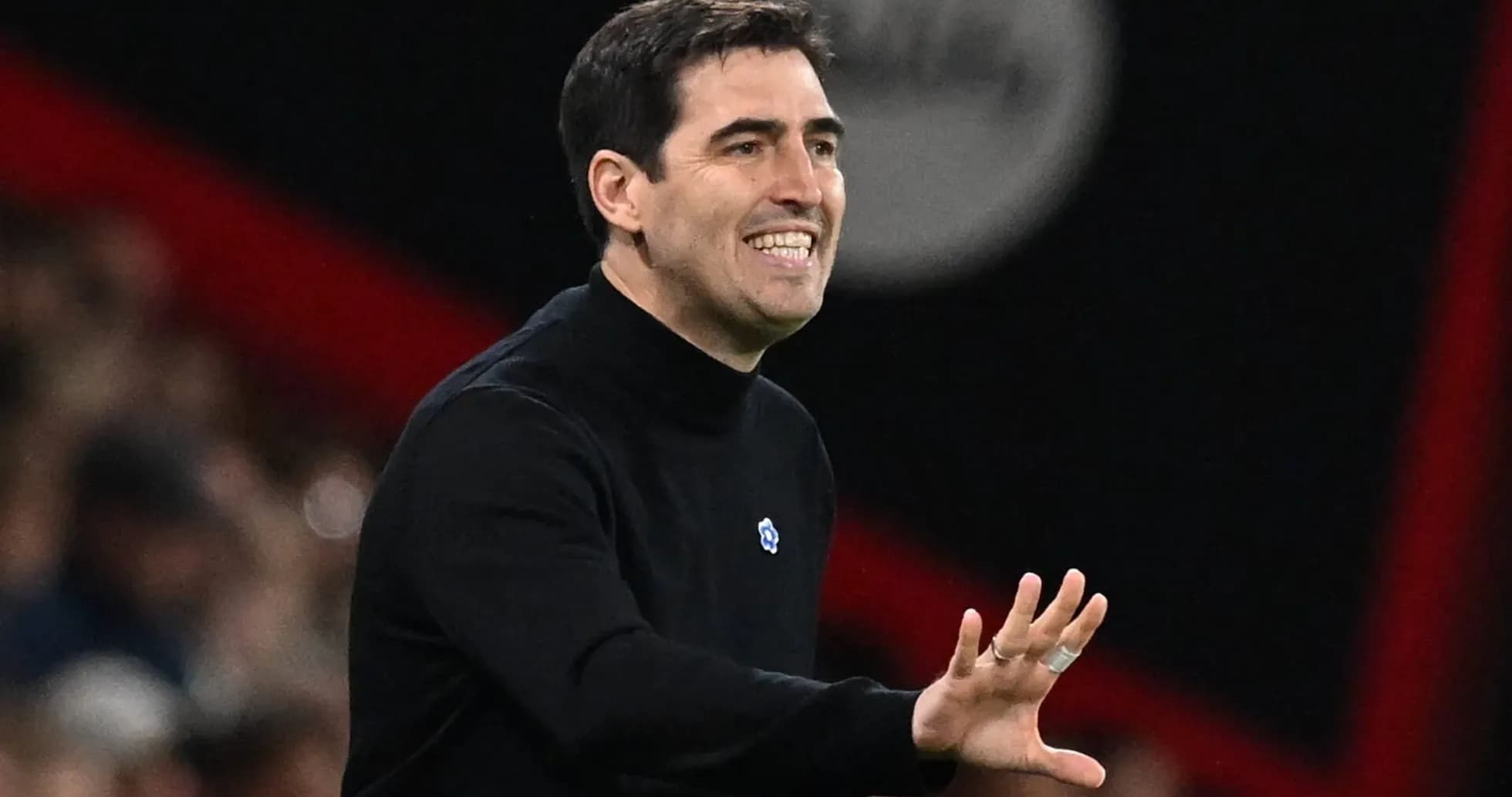 Coach gesturing during a match from the sidelines