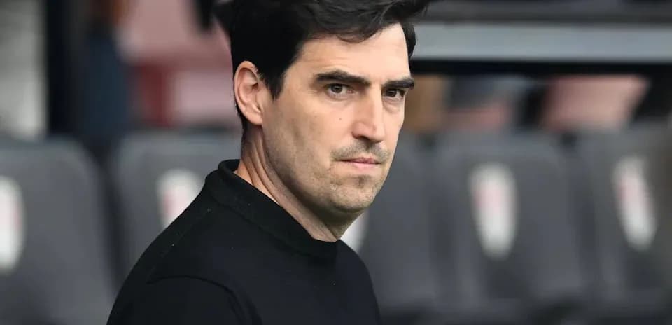 Coach observing from the sidelines during a match