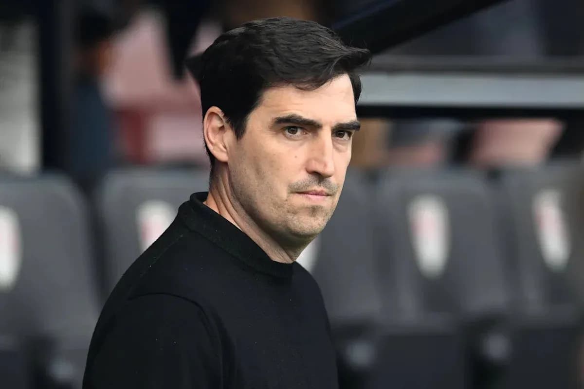 Coach observing from the sidelines during a match