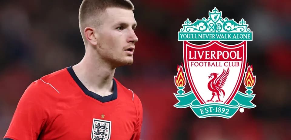 Player in England kit with Liverpool logo in background