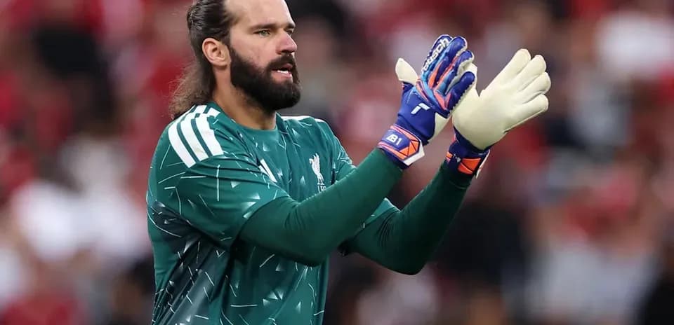 Goalkeeper gesturing during a match in green kit