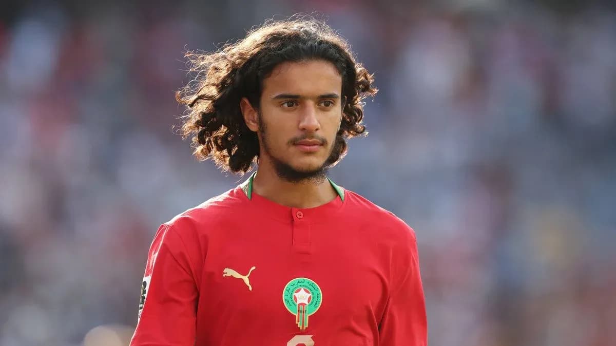 Player in red jersey during match warm-up