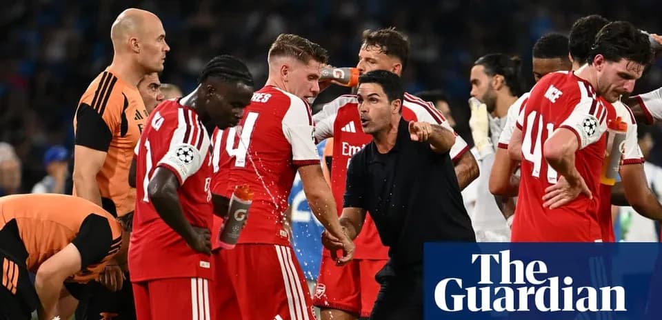 Arsenal players and coach during a match break