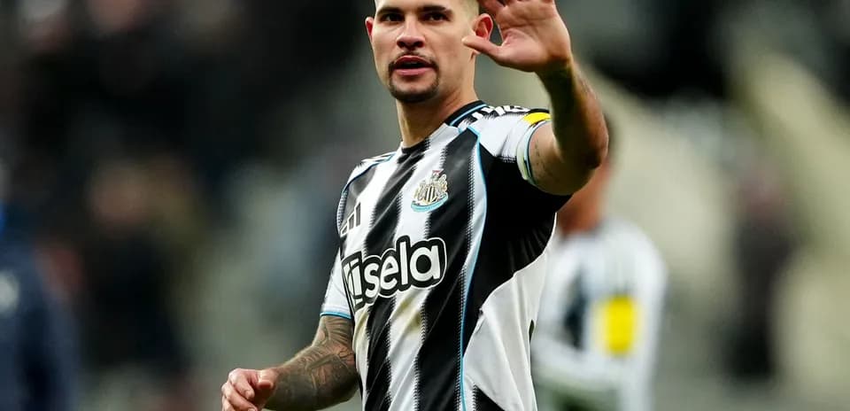 Player waving during match for Newcastle United