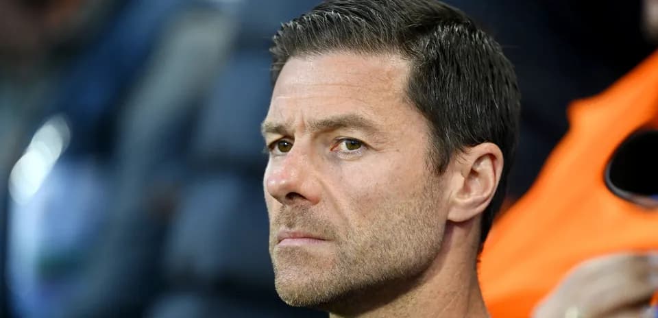 Close-up of a coach observing the match
