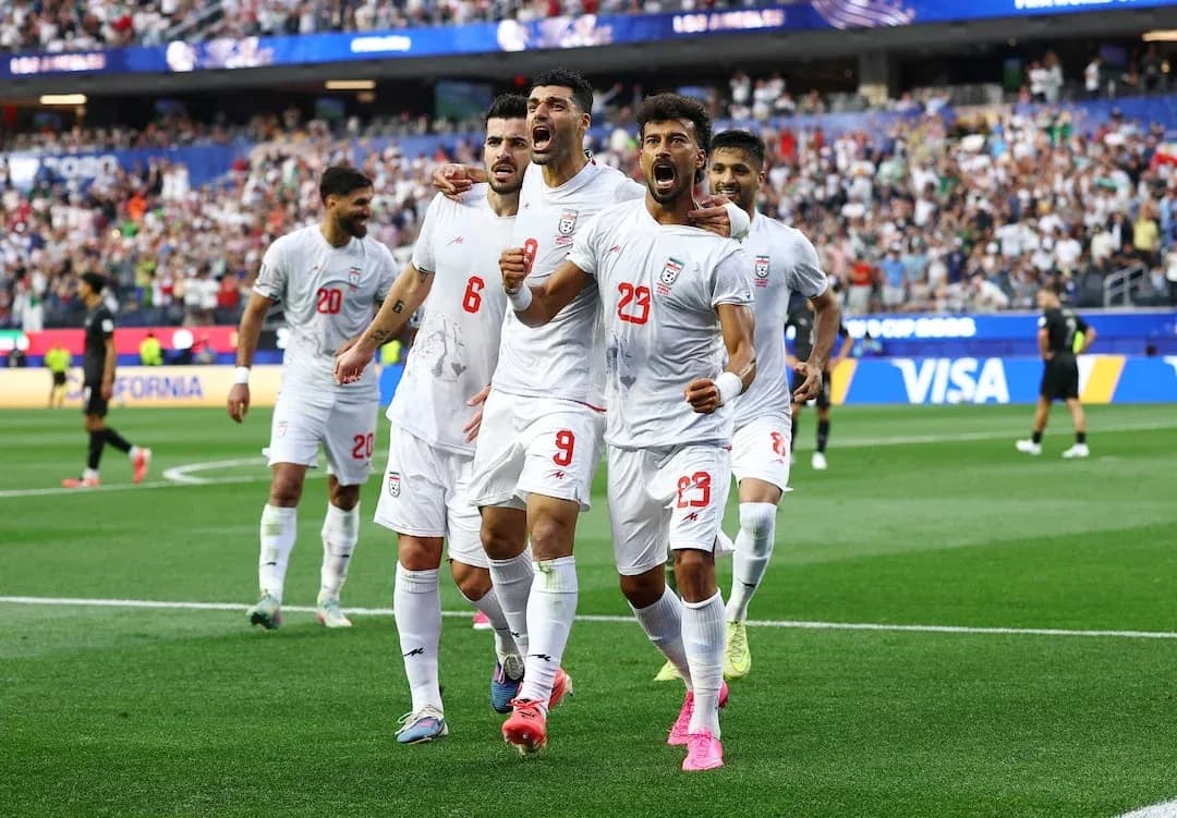 Iran players celebrating a goal during match