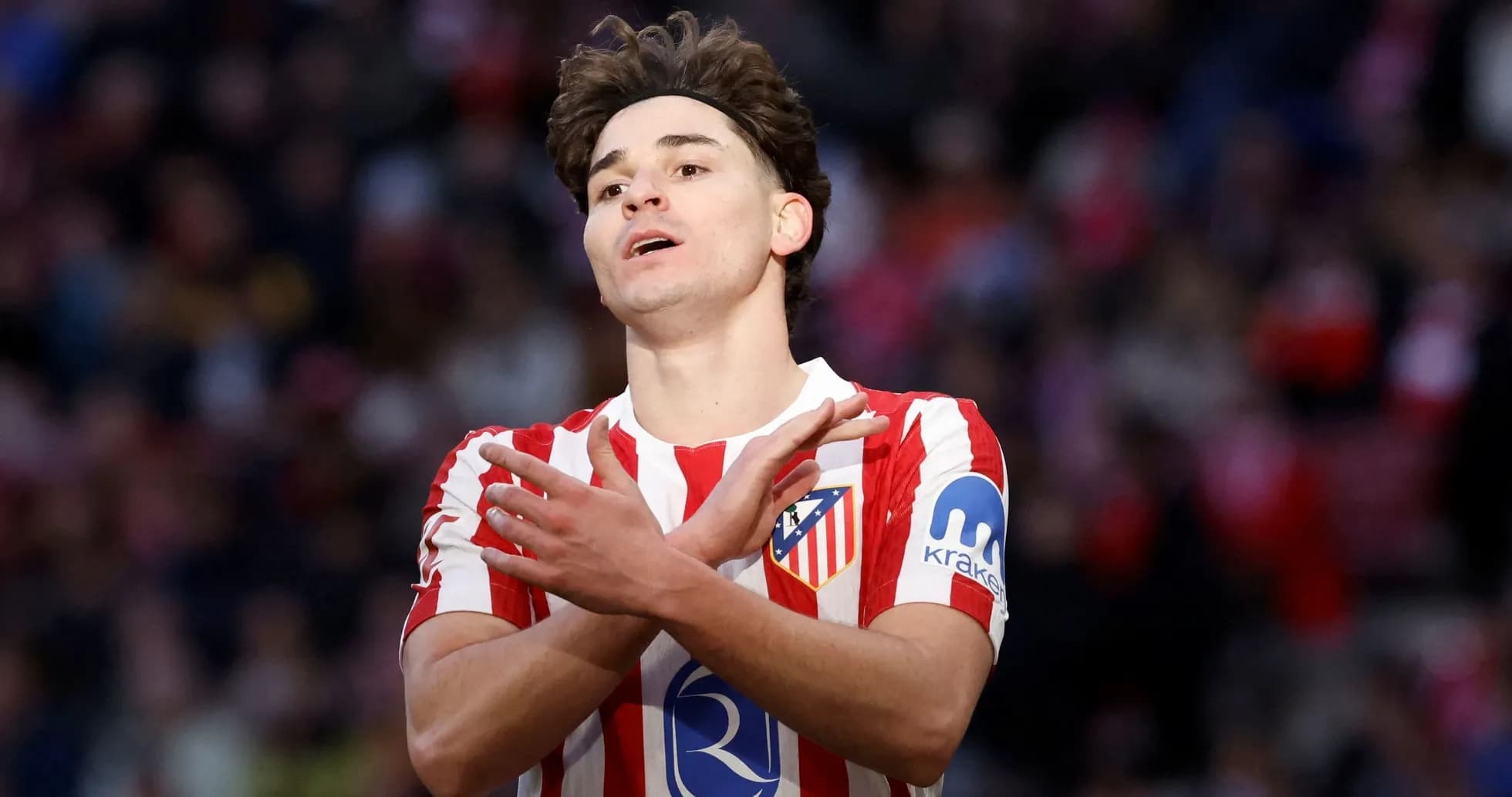 Atletico Madrid player gesturing during match
