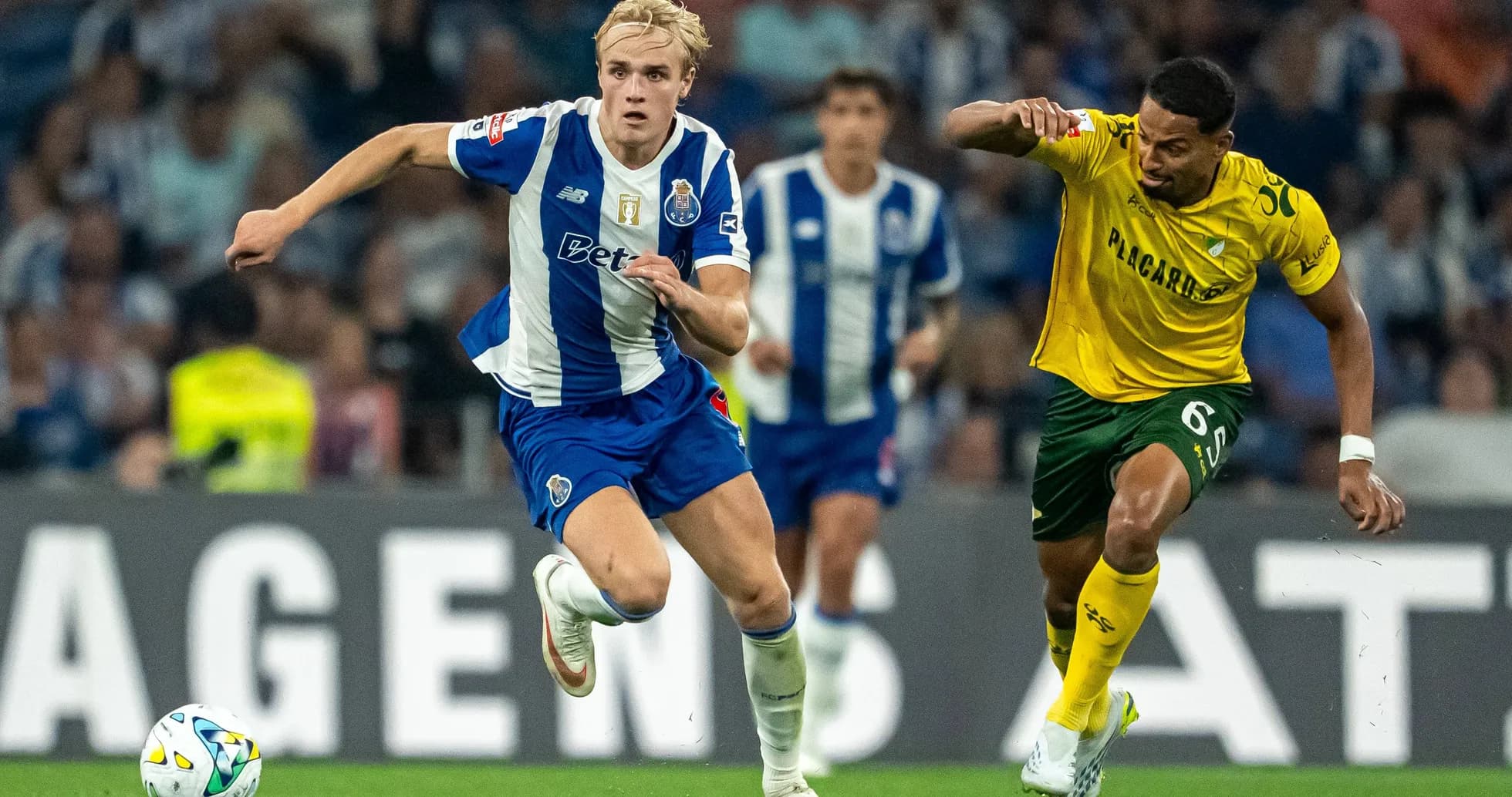 Player sprinting with ball during match action