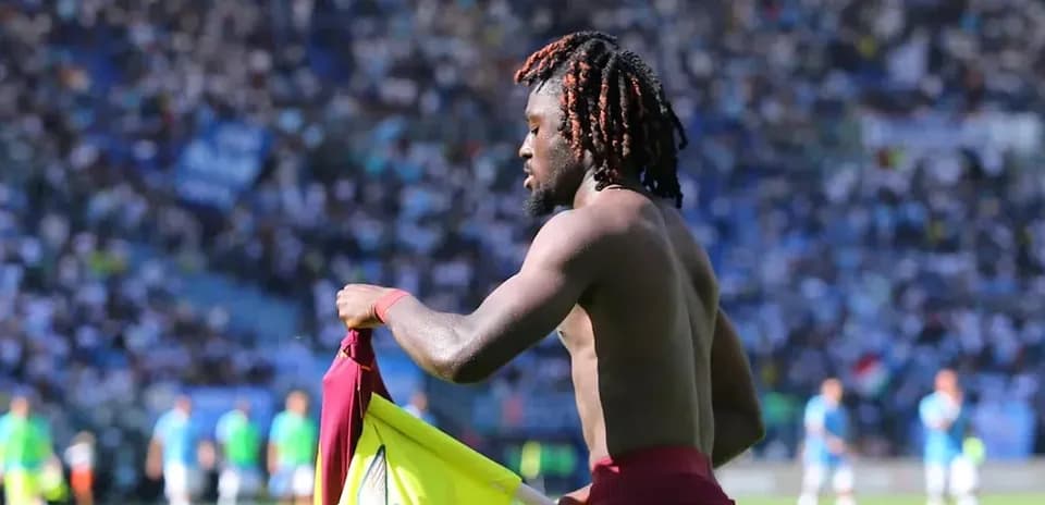 Player changing shirt during match at stadium