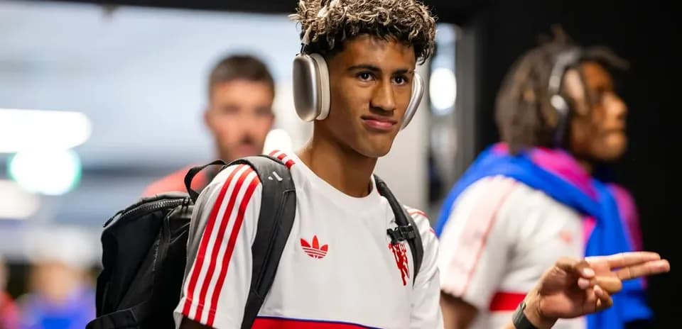 Player wearing headphones entering the venue