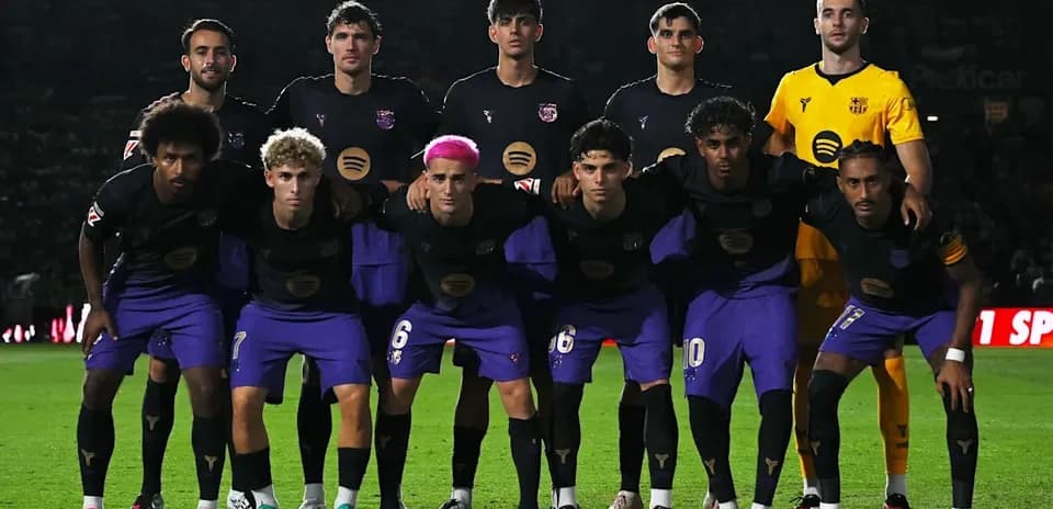 Football team posing for a group photo on field
