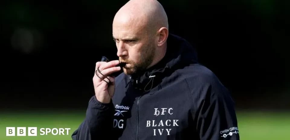 Coach with whistle during training session
