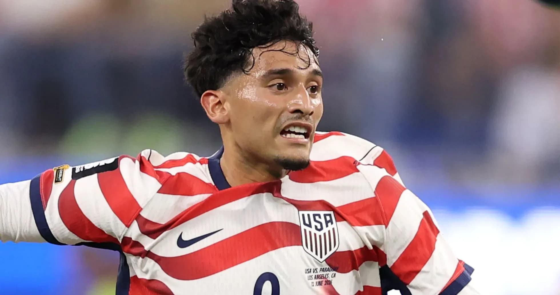 Player in USA jersey celebrating on the field