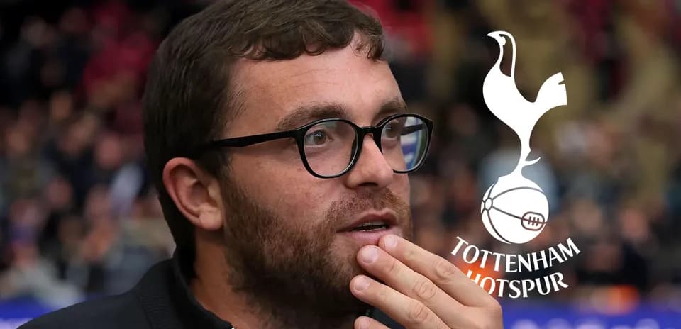 Man in glasses thinking at football match