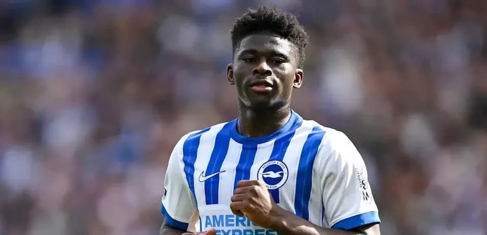 Player in blue and white kit during match