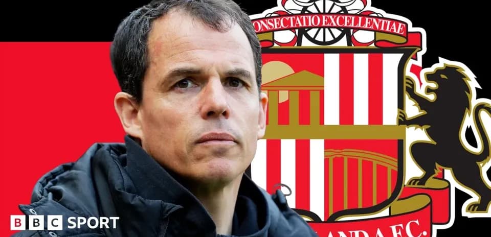 Sunderland manager with club logo in background