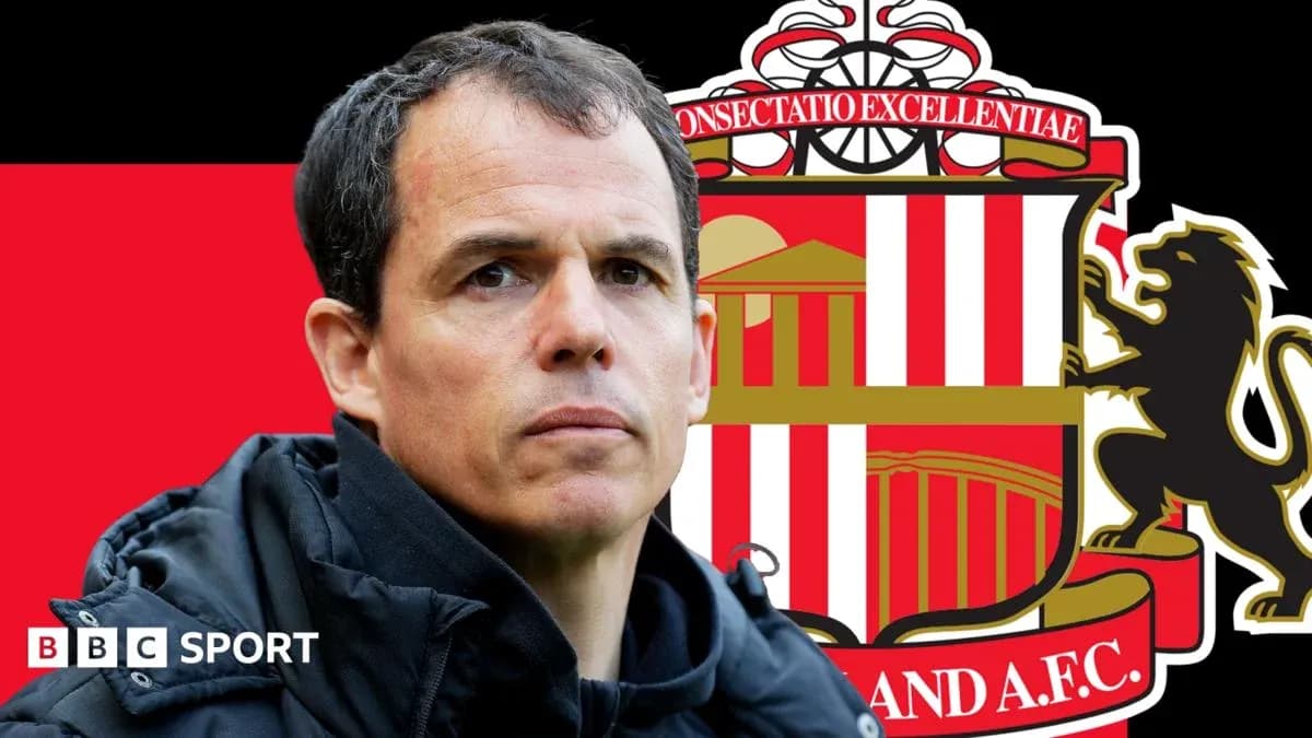 Sunderland manager with club logo in background
