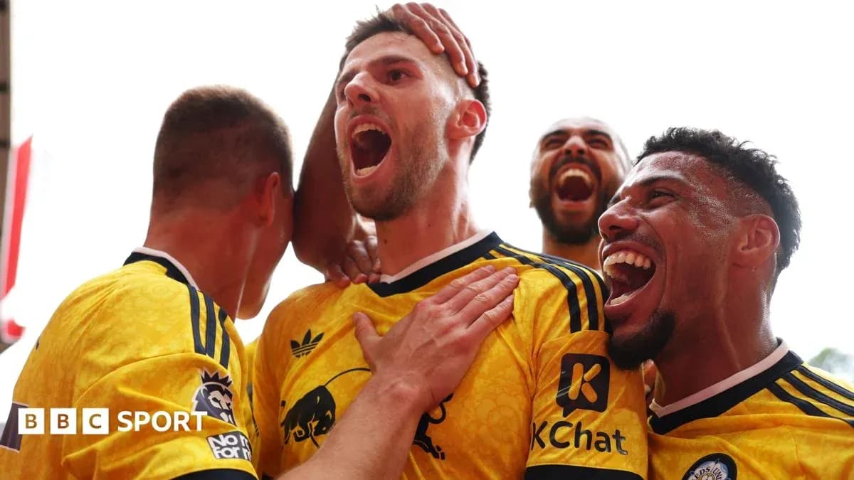 Players celebrating a goal in yellow jerseys