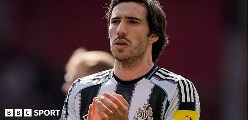 Player applauding on the field in team jersey