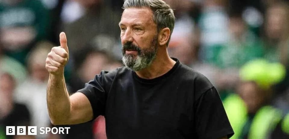 Manager giving thumbs up during match