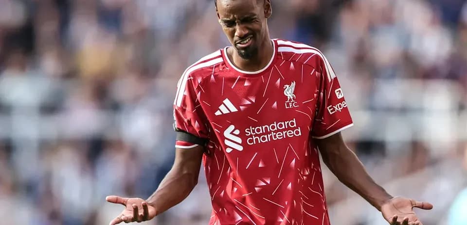 Liverpool player expressing frustration on the field
