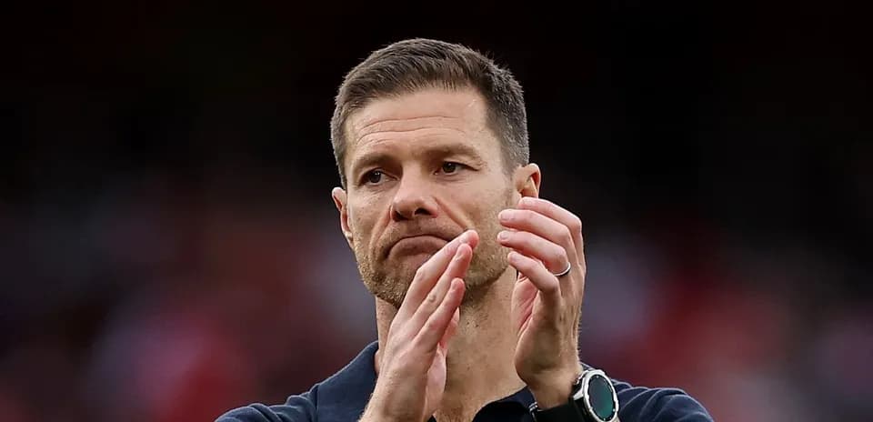 Coach applauding during match at stadium