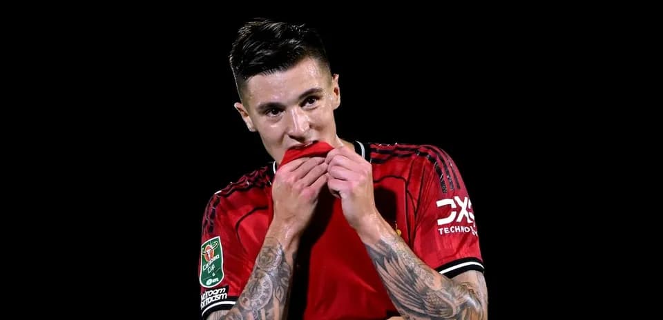 Player biting his jersey during match celebration