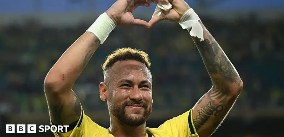 Neymar celebrating and making a heart gesture