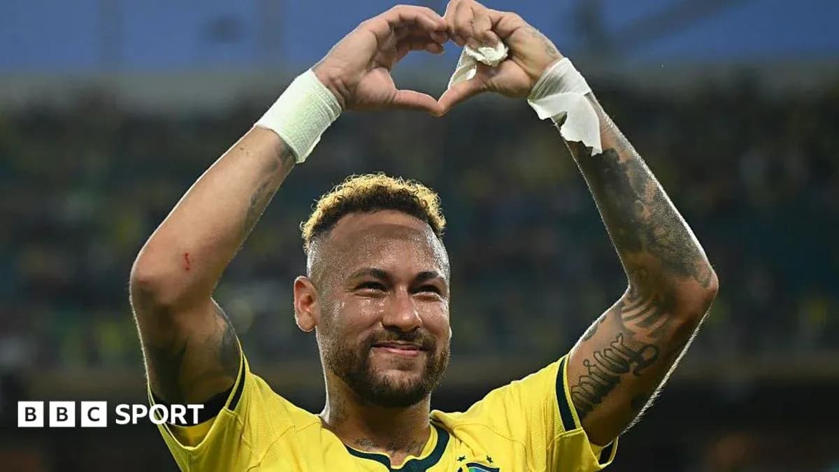 Neymar celebrating and making a heart gesture