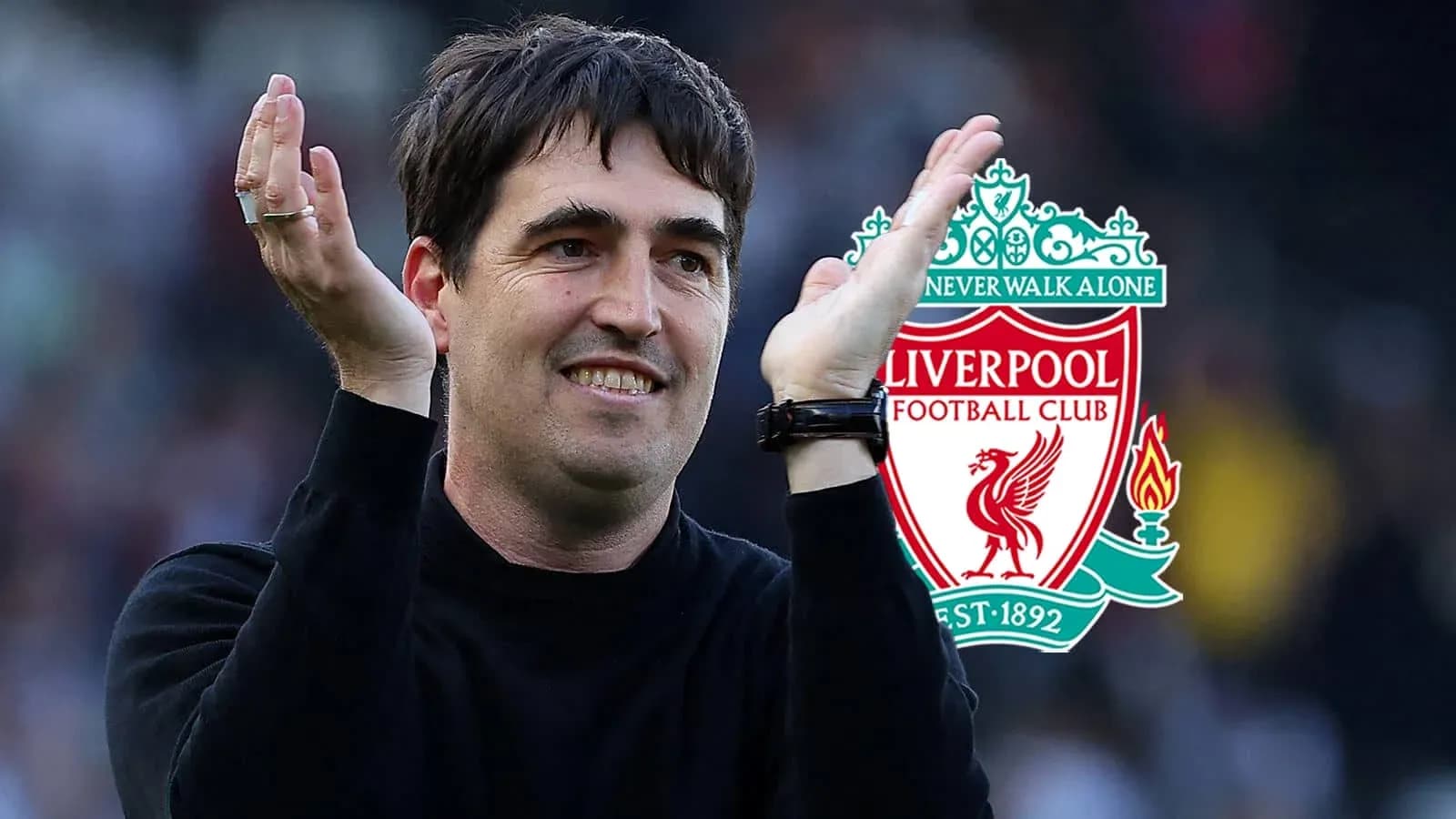 Coach applauding with Liverpool FC logo in background