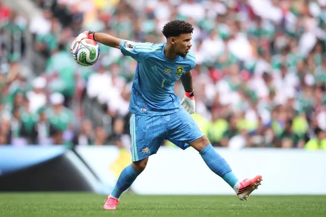 Goalkeeper throwing ball during a match