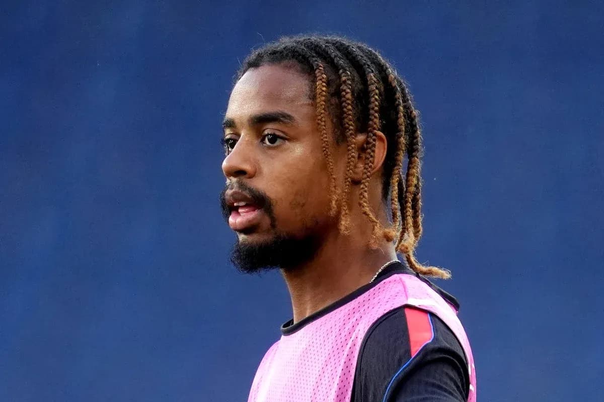 Player wearing a pink training vest during practice