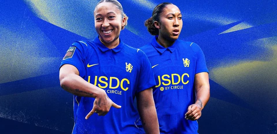 Player in blue Chelsea kit posing and smiling