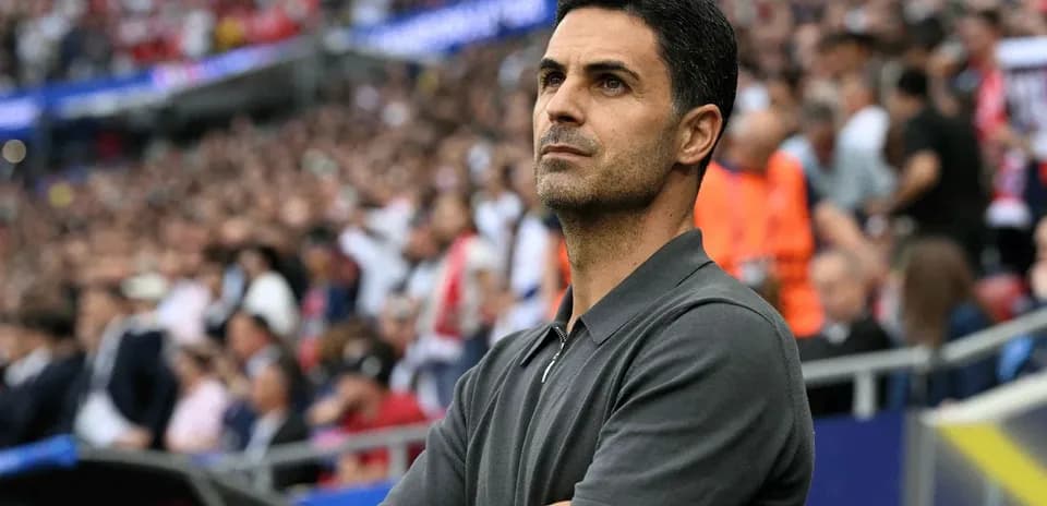 Coach observing the match from the sidelines