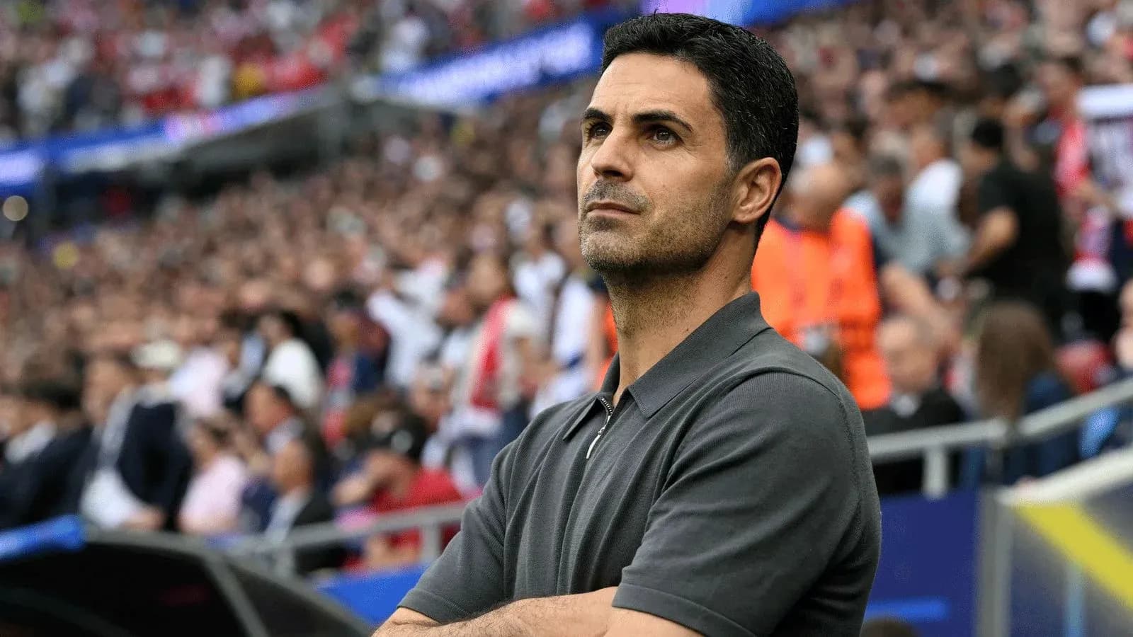 Coach observing the match from the sidelines