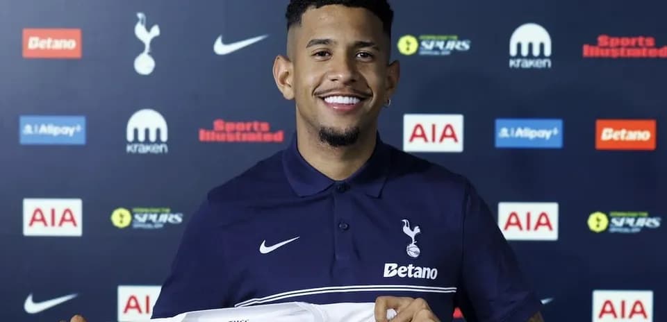 Player holding Tottenham Hotspur jersey at announcement