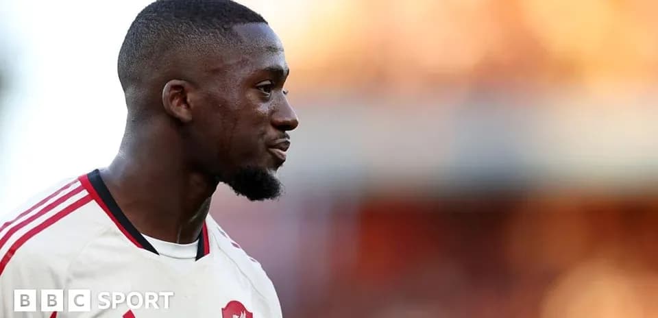 Player in Liverpool kit during match warm-up