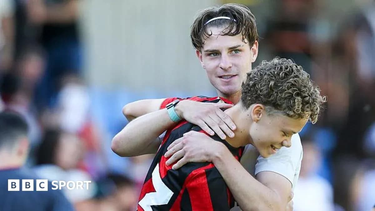 Two players embracing after a match