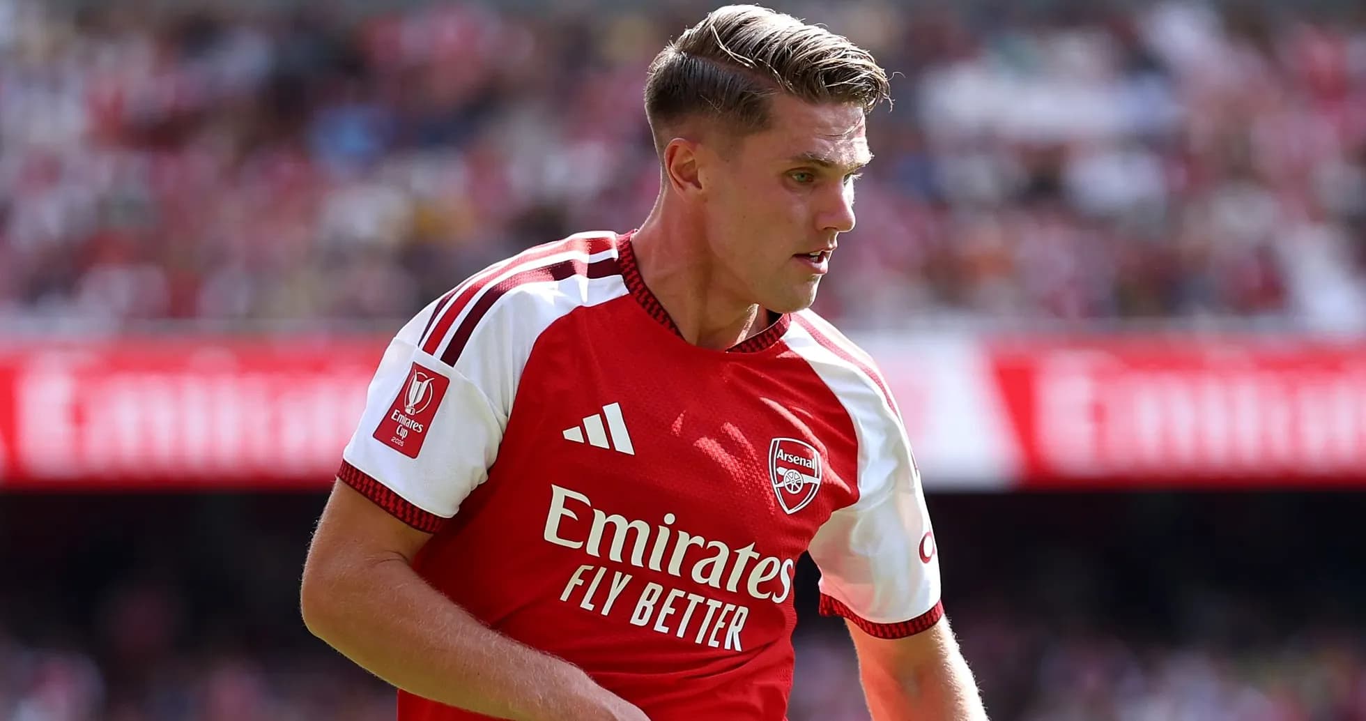 Arsenal player in red jersey during match action
